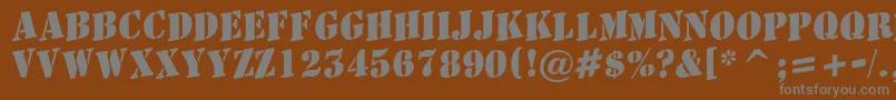 フォントAStamperupBold – 茶色の背景に灰色の文字
