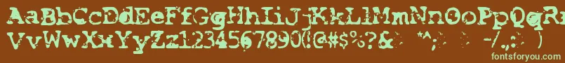 フォントSmash – 緑色の文字が茶色の背景にあります。