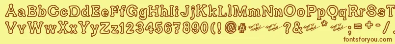 フォントAriendesse – 茶色の文字が黄色の背景にあります。