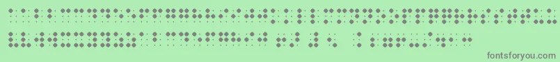 BraillenumBold-fontti – harmaat kirjasimet vihreällä taustalla