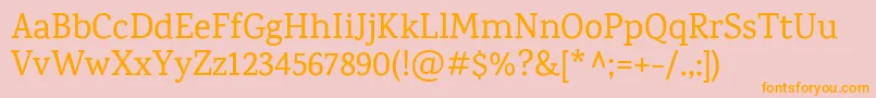 KarmaMedium-Schriftart – Orangefarbene Schriften auf rosa Hintergrund