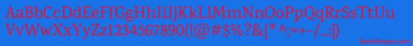KarmaMedium-Schriftart – Rote Schriften auf blauem Hintergrund