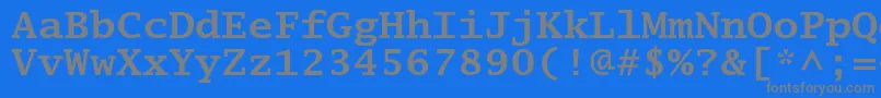 LucidatypewriterstdBold-fontti – harmaat kirjasimet sinisellä taustalla