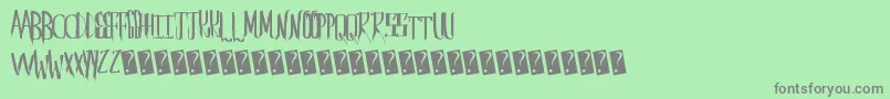 Saberhusk Font – Gray Fonts on Green Background