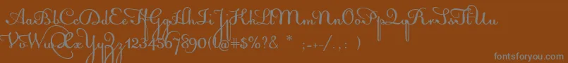 AcquestScript-fontti – harmaat kirjasimet ruskealla taustalla
