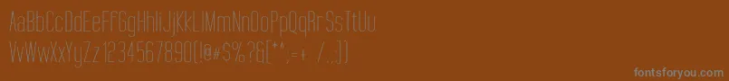 Шрифт TallFilmsExpanded – серые шрифты на коричневом фоне