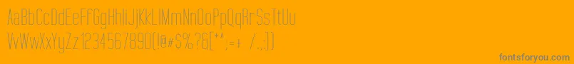 TallFilmsExpanded-Schriftart – Graue Schriften auf orangefarbenem Hintergrund