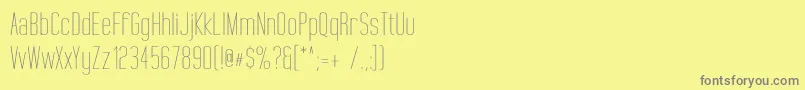 TallFilmsExpanded-Schriftart – Graue Schriften auf gelbem Hintergrund
