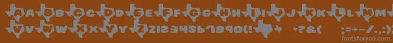 フォントTexas – 茶色の背景に灰色の文字