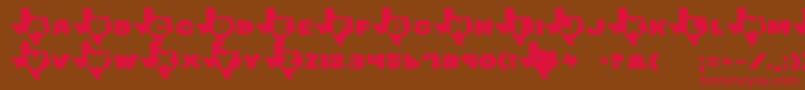 フォントTexas – 赤い文字が茶色の背景にあります。