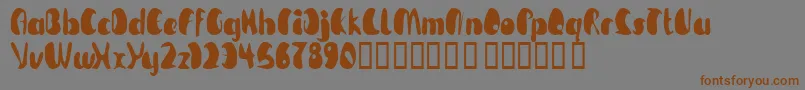 TmBeguiled-Schriftart – Braune Schriften auf grauem Hintergrund