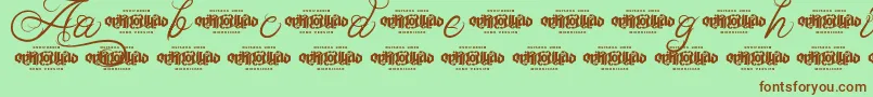 Шрифт UnblessedScriptDemo – коричневые шрифты на зелёном фоне