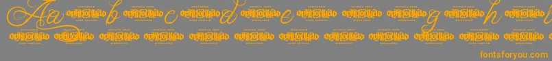 UnblessedScriptDemo Font – Orange Fonts on Gray Background