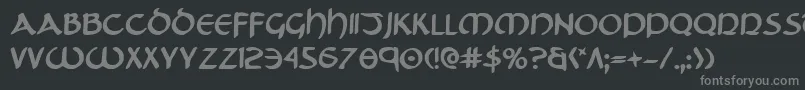 フォントTristramb – 黒い背景に灰色の文字