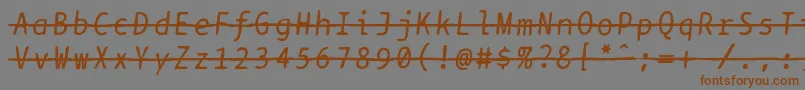 フォントBptypewritedamagedstrikethroughitalics – 茶色の文字が灰色の背景にあります。