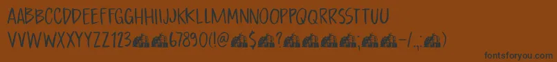 Шрифт DkBoardingHouseI – чёрные шрифты на коричневом фоне