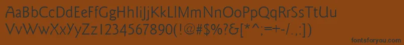 フォントGoudysansRegular – 黒い文字が茶色の背景にあります
