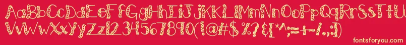 Fonte Kbwitchinghour – fontes amarelas em um fundo vermelho