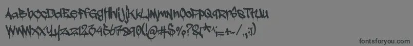 フォントAdrip1 – 黒い文字の灰色の背景