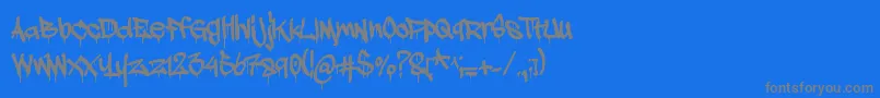 Adrip1-Schriftart – Graue Schriften auf blauem Hintergrund