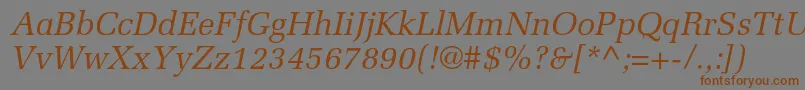 フォントMeliorltstdItalic – 茶色の文字が灰色の背景にあります。