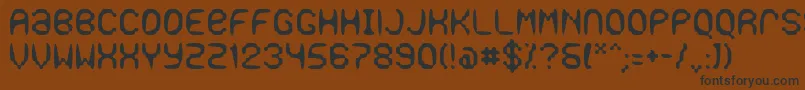 フォントGaseous – 黒い文字が茶色の背景にあります