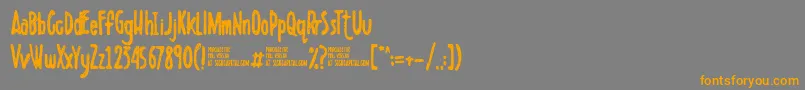 フォントScribbletDemo – オレンジの文字は灰色の背景にあります。