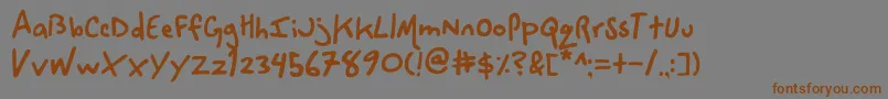 フォントSpaceCowboy – 茶色の文字が灰色の背景にあります。