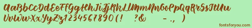 Шрифт Wildcreaturessample – коричневые шрифты на зелёном фоне