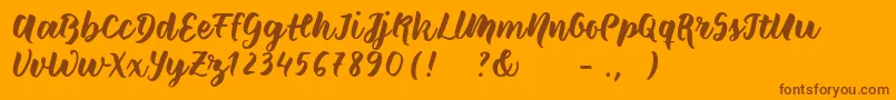 Wildcreaturessample-Schriftart – Braune Schriften auf orangefarbenem Hintergrund