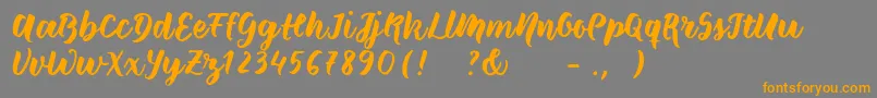 Wildcreaturessample Font – Orange Fonts on Gray Background