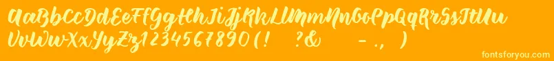 Шрифт Wildcreaturessample – жёлтые шрифты на оранжевом фоне