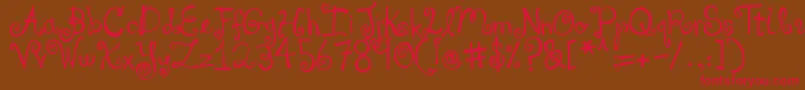 フォントDjbYouMakeMeBlush – 赤い文字が茶色の背景にあります。