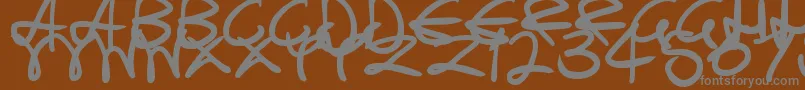 SwirlyCurlyInks Font – Gray Fonts on Brown Background