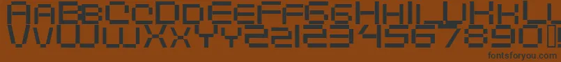 フォントDigitalema – 黒い文字が茶色の背景にあります