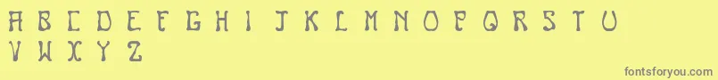 フォントNouveau – 黄色の背景に灰色の文字