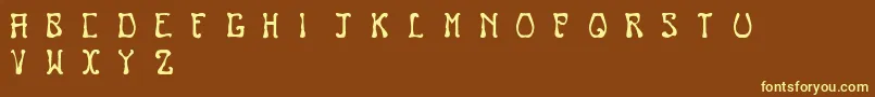Nouveau Font – Yellow Fonts on Brown Background