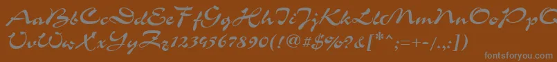 GrinyaHaevy-fontti – harmaat kirjasimet ruskealla taustalla