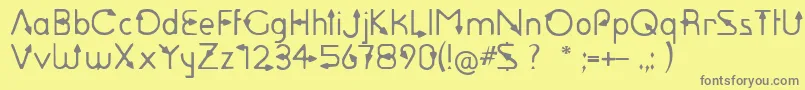 フォントSagittarius – 黄色の背景に灰色の文字