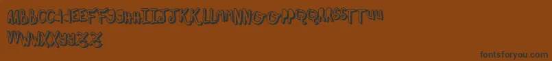 OhMyOhLaLaYeah2-fontti – mustat fontit ruskealla taustalla