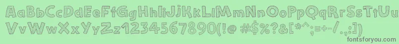 フォントStefanieDots – 緑の背景に灰色の文字
