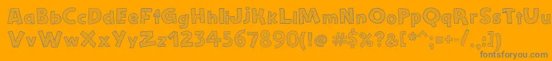 StefanieDots-fontti – harmaat kirjasimet oranssilla taustalla