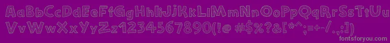 StefanieDots-fontti – harmaat kirjasimet violetilla taustalla