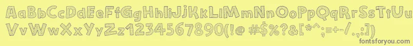フォントStefanieDots – 黄色の背景に灰色の文字