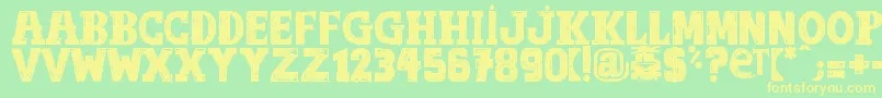 フォントOutOfTune – 黄色の文字が緑の背景にあります