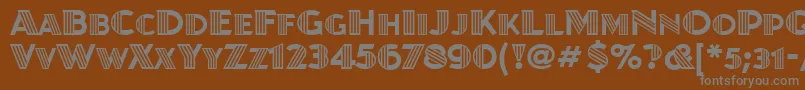 フォントJuanitadecoitcTt – 茶色の背景に灰色の文字