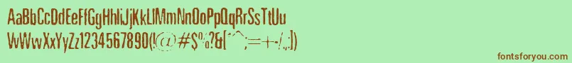 NicotineStains Font – Brown Fonts on Green Background