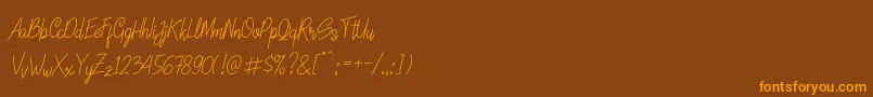 Fonte LinoleoScript – fontes laranjas em um fundo marrom