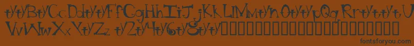 フォントBtBongBlastedAliensTrialTrialVersion – 黒い文字が茶色の背景にあります