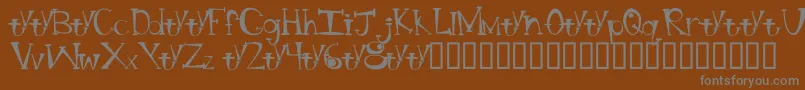 BtBongBlastedAliensTrialTrialVersion-Schriftart – Graue Schriften auf braunem Hintergrund